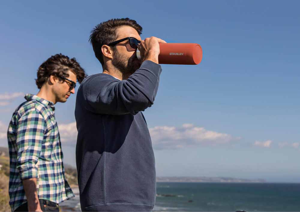 Man drinking from Ceramivac™ bottle